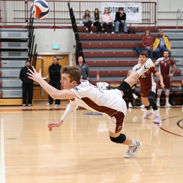 Tyler diving for a dig during a match